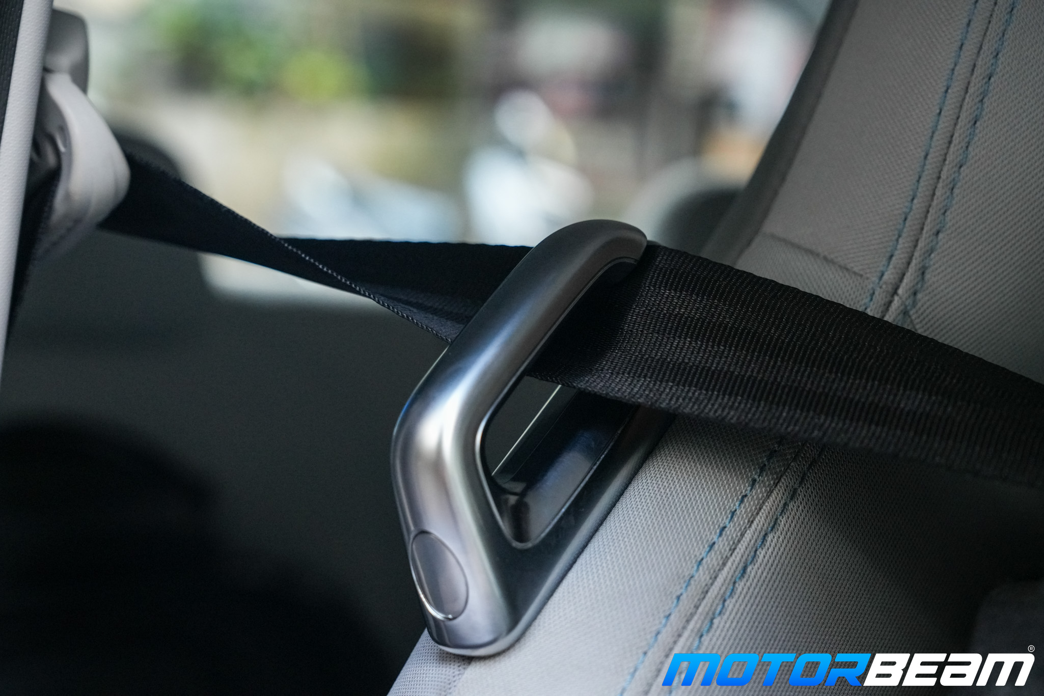 Driver's seatbelt easily slips out of the bracket and makes it hard to reach when you want to quickly buckle up.